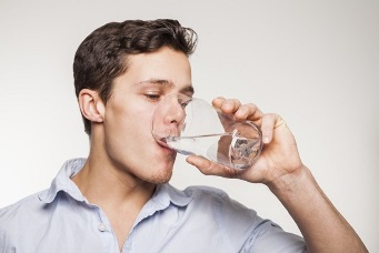 the instruction to drink the capsule with a glass of water